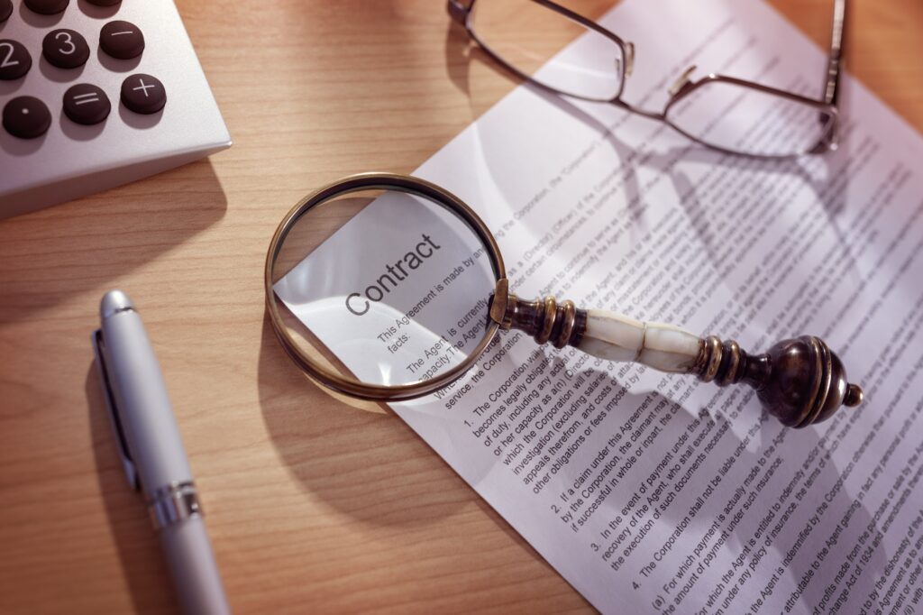 Magnifying glass on a legal contract